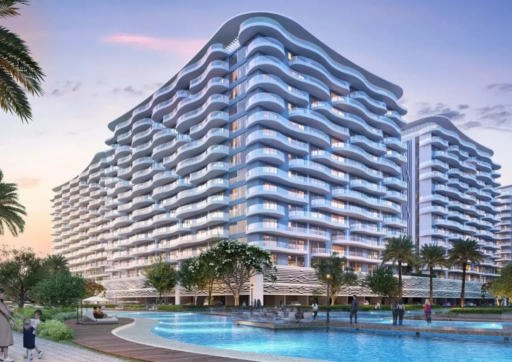 DAMAC Lagoons Views Phase 2 — wave-balcony apartment towers on the lagoon at dusk in Dubailand
